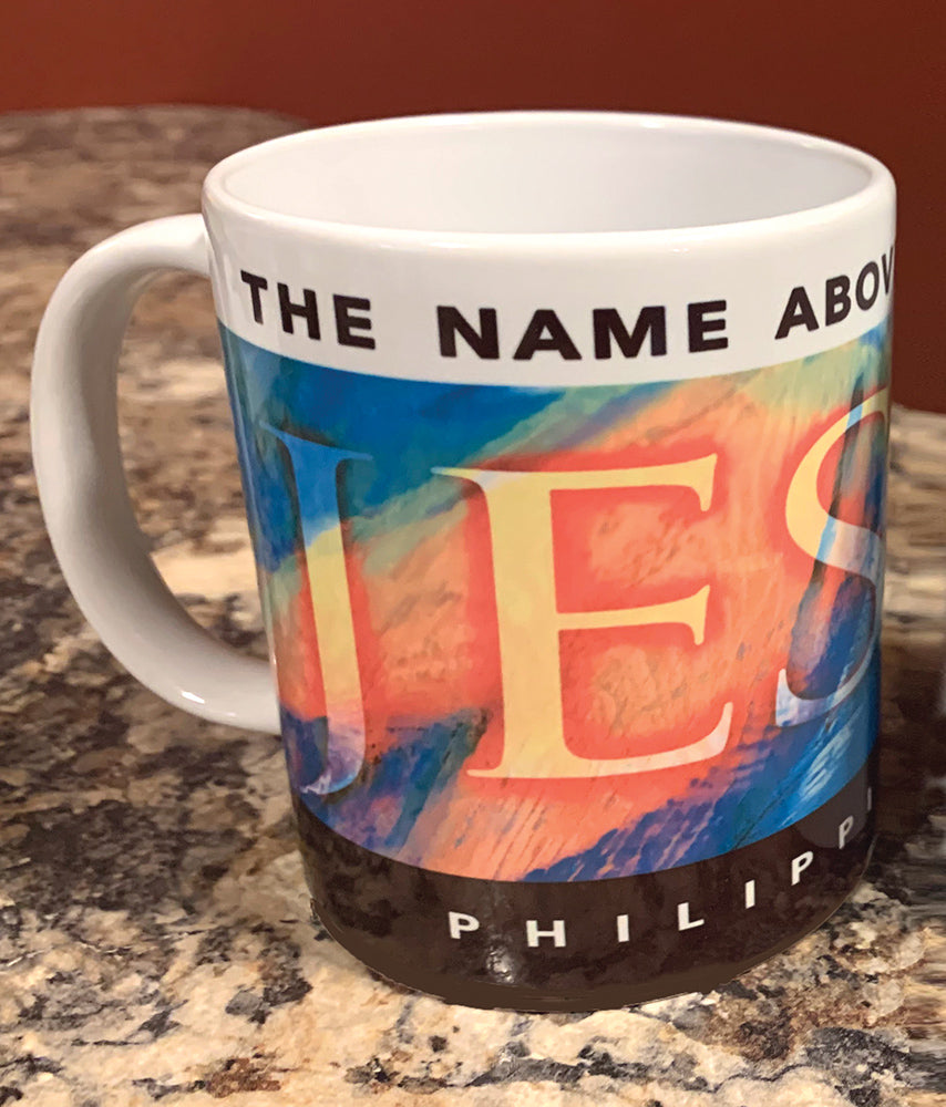 "Jesus Name Above" on white mug