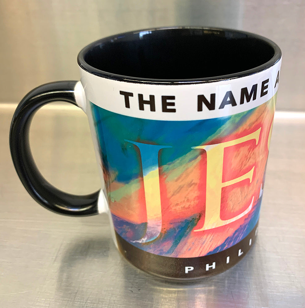 "Jesus Name Above" on black mug